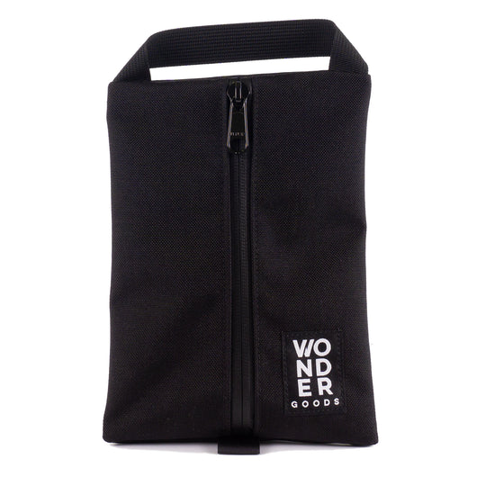 The black center zip Wonder Goods carry-all pouch! 