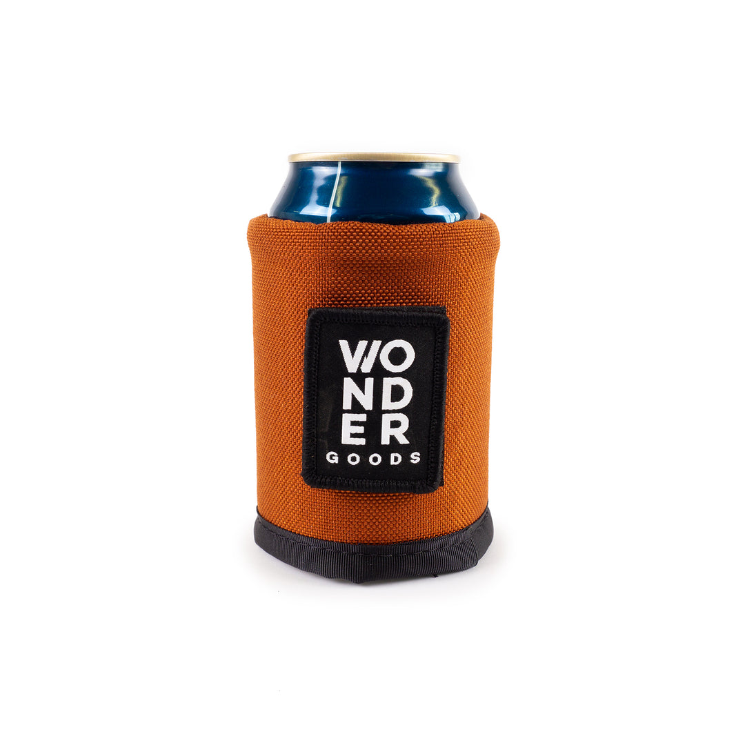 Orange rust colored Wonder Goods beverage koozie